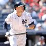 New York Yankees right fielder Giancarlo Stanton (27) runs to first after hitting a solo home run against the Houston Astros during the seventh inning at Yankee Stadium.
