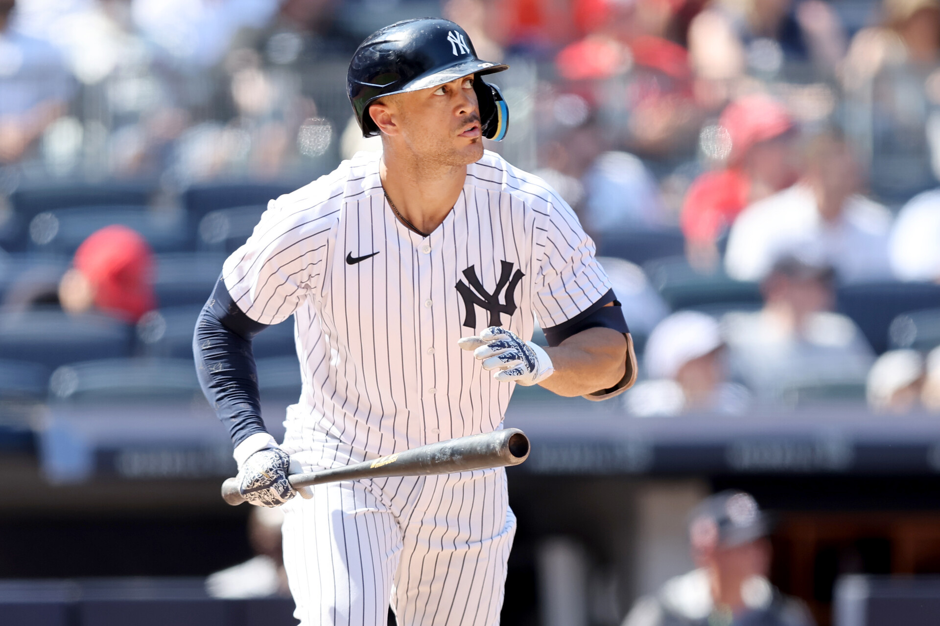 New York Yankees right fielder Giancarlo Stanton (27) runs to first after hitting a solo home run against the Houston Astros during the seventh inning at Yankee Stadium.