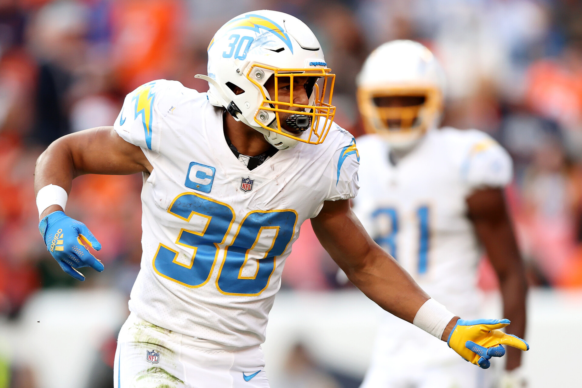 Austin Ekeler #30 of the Los Angeles Chargers reacts during the first half of the game against the Denver Broncos at Empower Field At Mile High on November 28, 2021 in Denver, Colorado.
