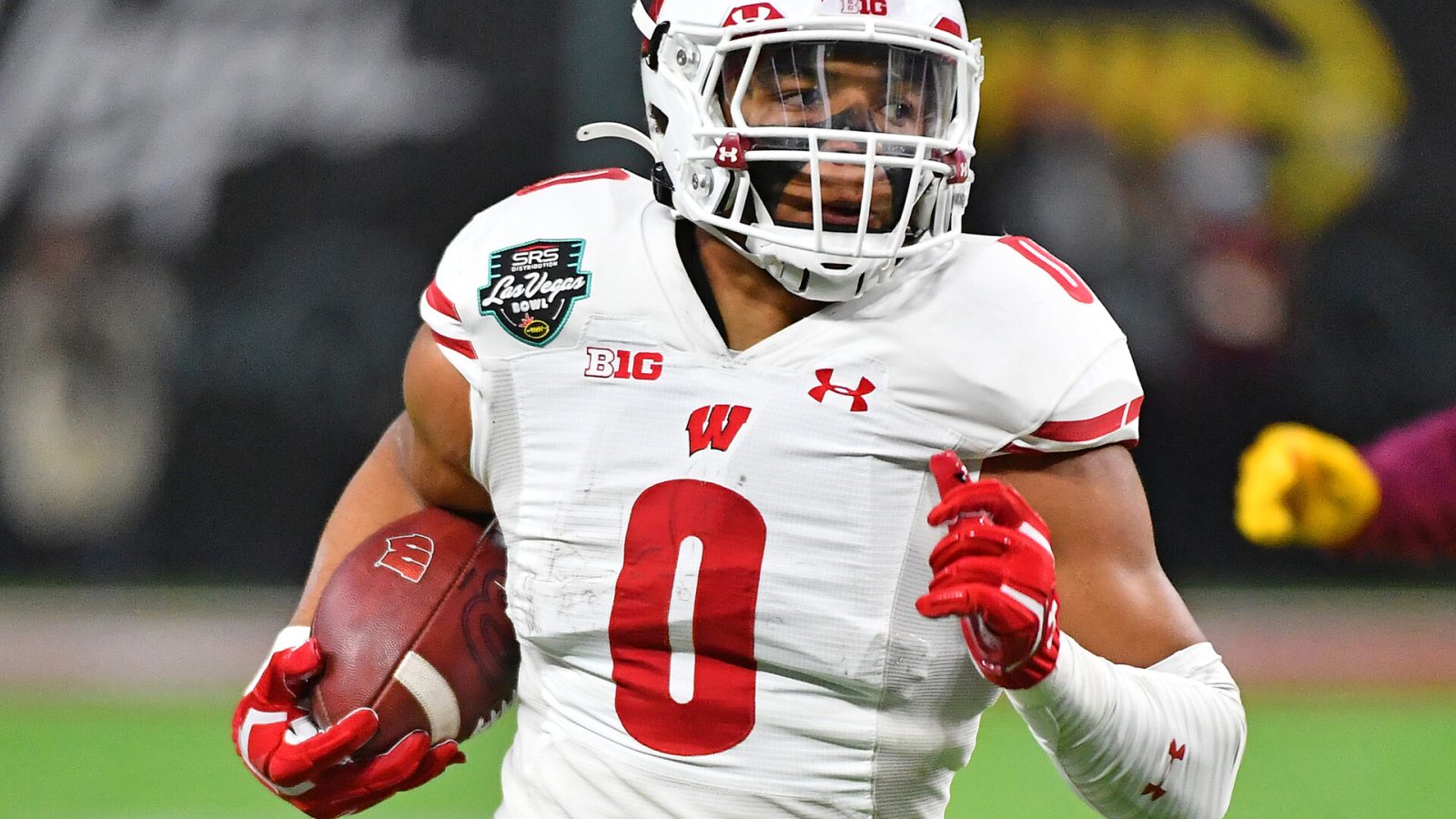 Wisconsin Badgers running back Braelon Allen (0) runs up field against the Arizona State Sun Devils during the 2021 Las Vegas Bowl at Allegiant Stadium.