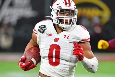 Wisconsin Badgers running back Braelon Allen (0) runs up field against the Arizona State Sun Devils during the 2021 Las Vegas Bowl at Allegiant Stadium.