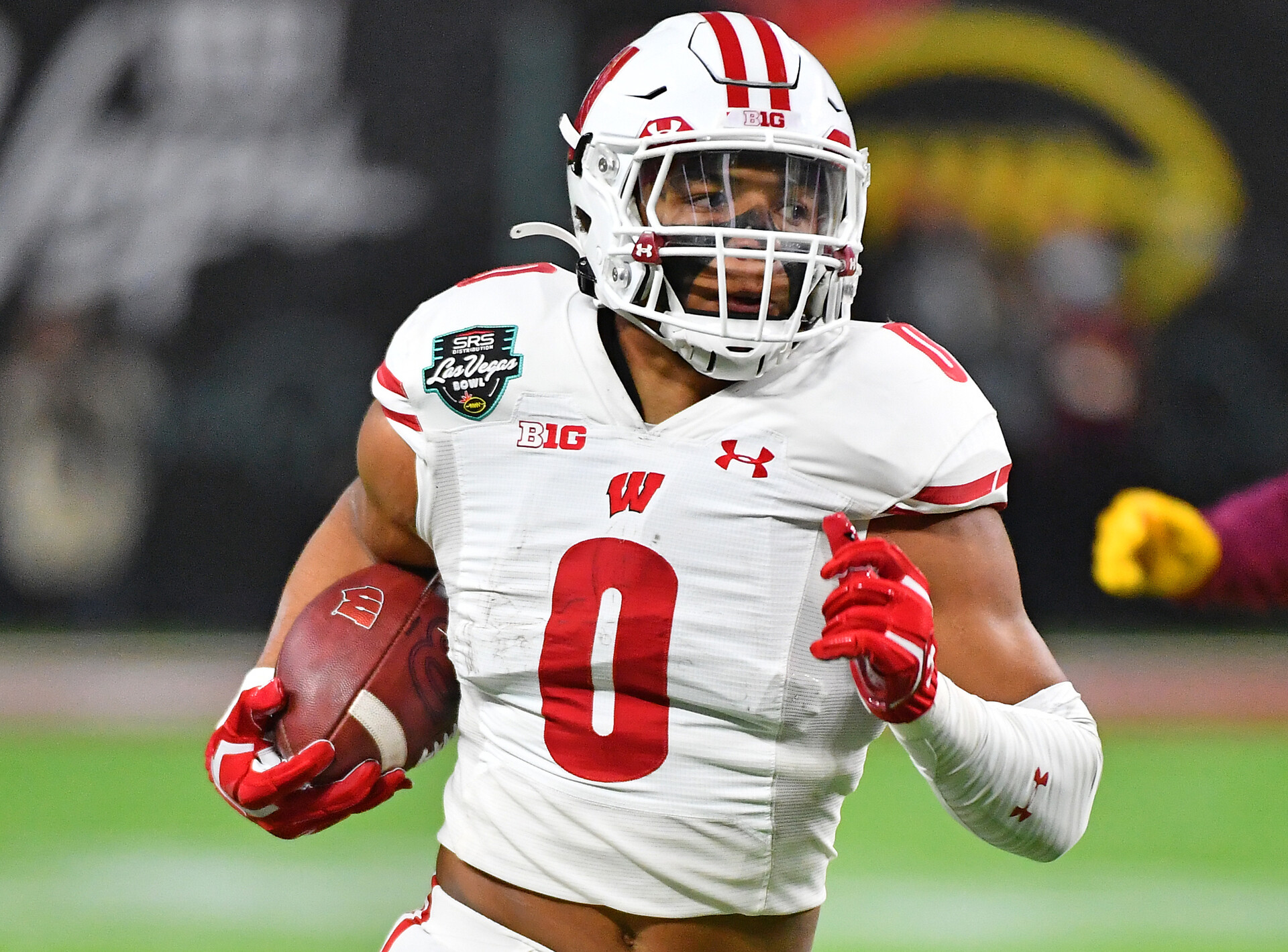 Wisconsin Badgers running back Braelon Allen (0) runs up field against the Arizona State Sun Devils during the 2021 Las Vegas Bowl at Allegiant Stadium.