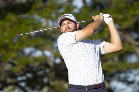 Cameron Young hits his tee shot on the 11th hole
