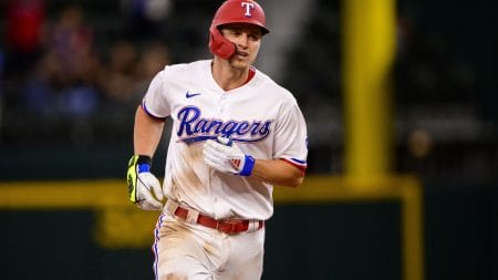 Texas Rangers shortstop Corey Seager (5) rounds the bases after hitting a home run against the Houston Astros during the ninth inning at Globe Life Field.