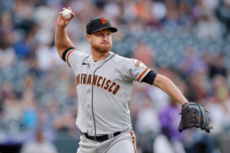 San Francisco Giants starting pitcher Alex Cobb (38) throws to first for an out in the second inning against the Colorado Rockies at Coors Field.