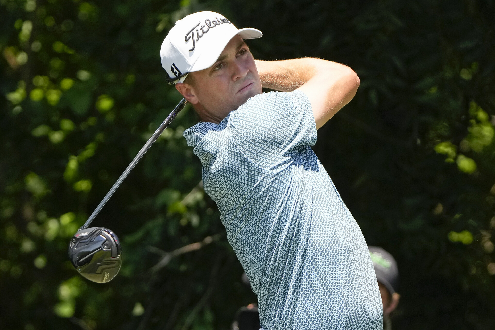 Justin Thomas plays his shot from the sixth tee