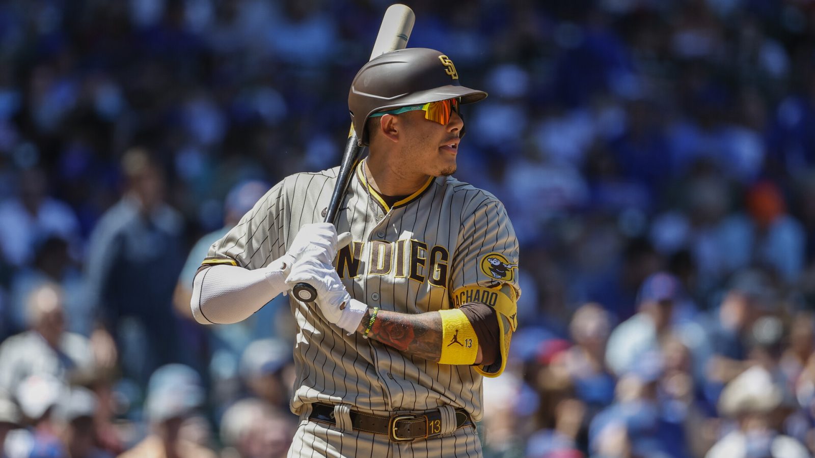 San Diego Padres third baseman Manny Machado (13) bats against the Chicago Cubs during the second inning at Wrigley Field.