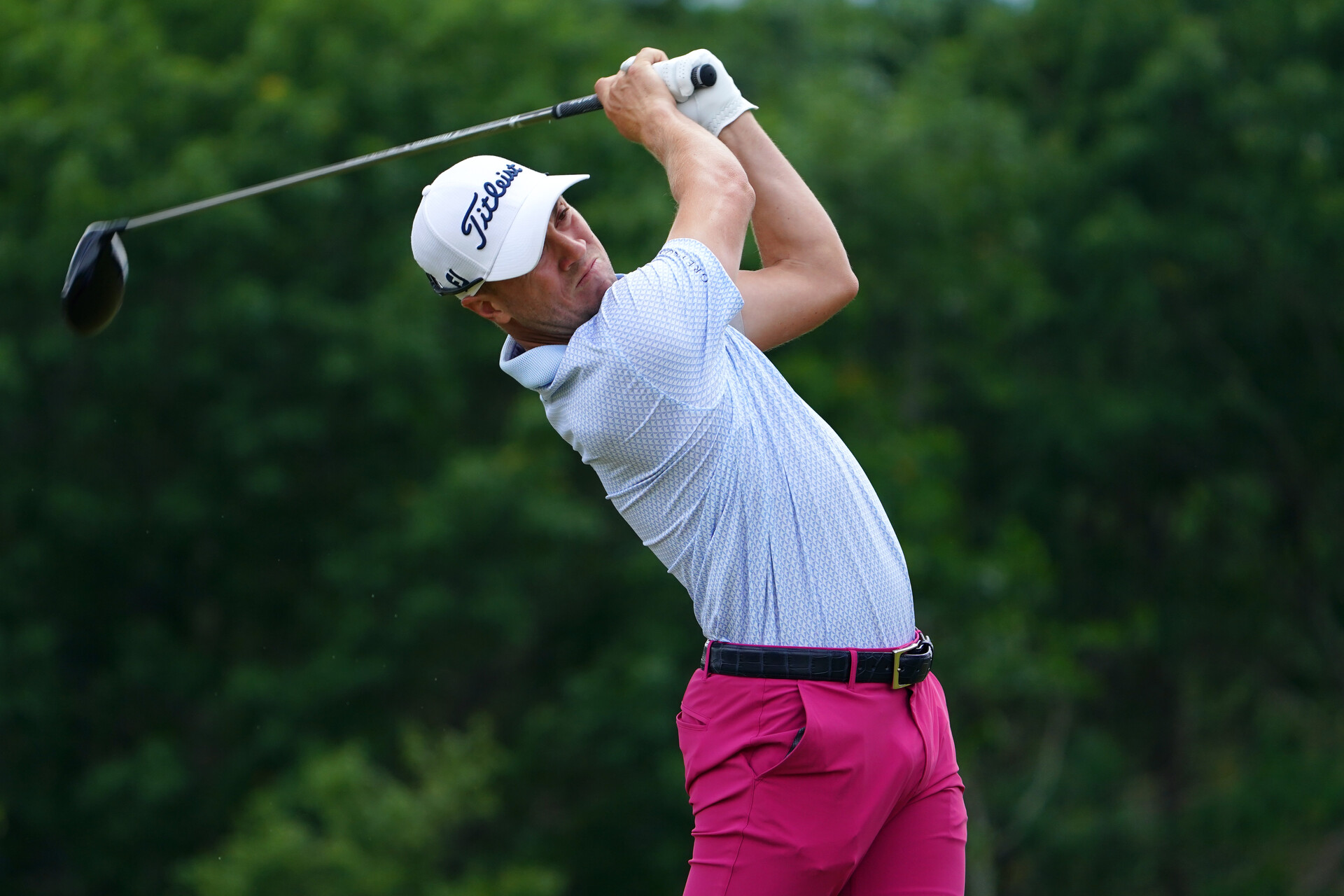 Justin Thomas plays his shot from the eighth tee