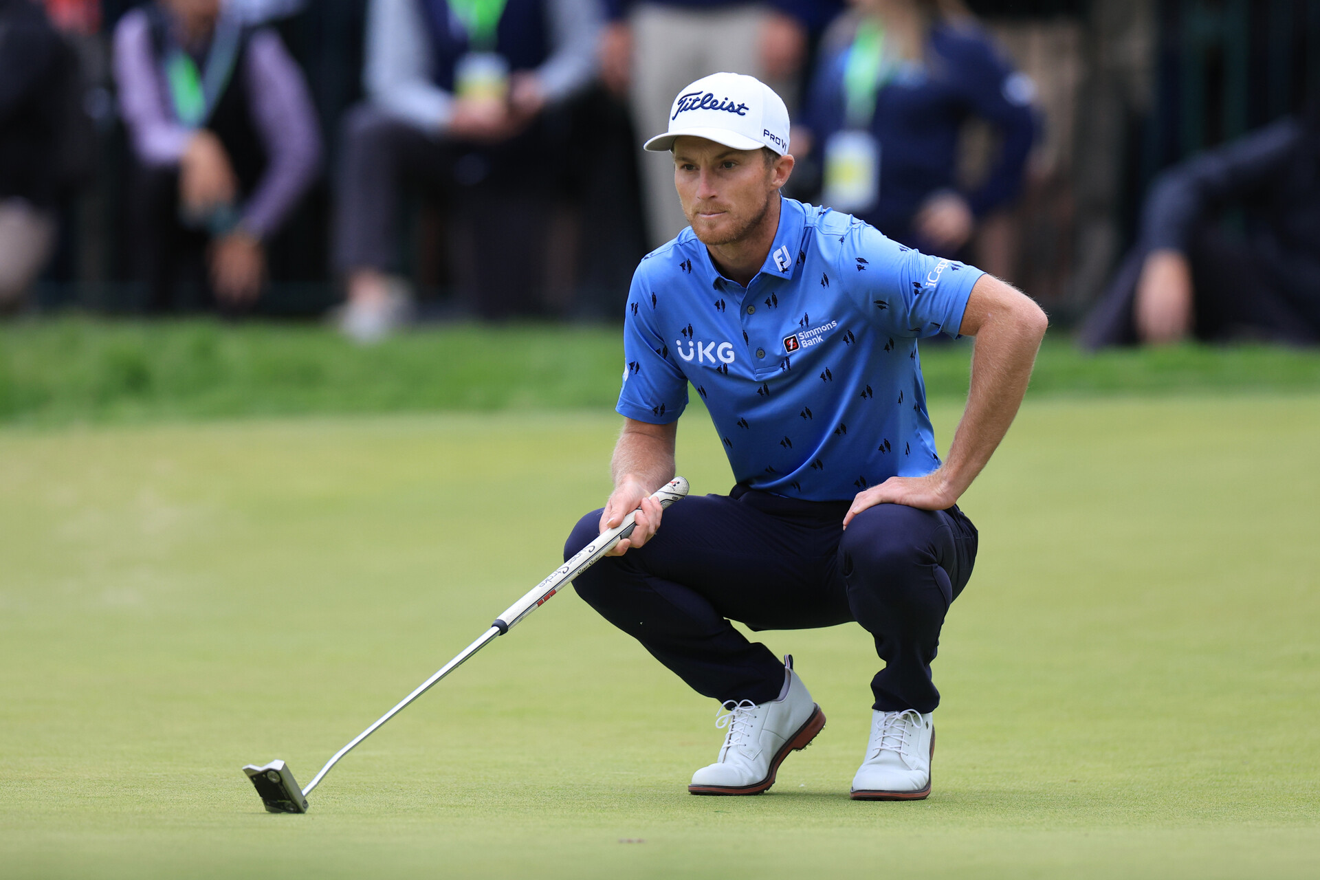 Will Zalatoris lines up a putt on the 18th green during the final round of the U.S. Open golf tournament.