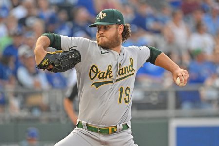 Oakland Athletics starting pitcher Cole Irvin (19) delivers a pitch during the first inning against the Kansas City Royals at Kauffman Stadium.