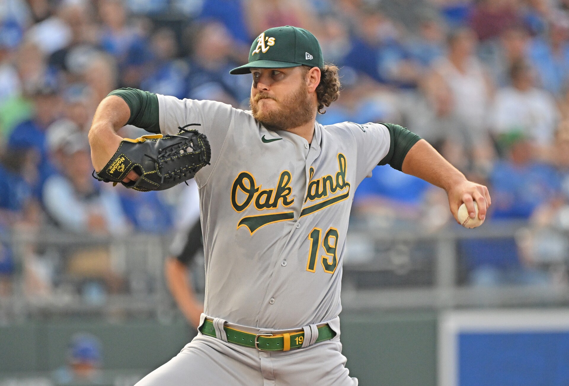 Oakland Athletics starting pitcher Cole Irvin (19) delivers a pitch during the first inning against the Kansas City Royals at Kauffman Stadium.