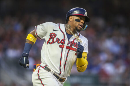 Atlanta Braves right fielder Ronald Acuna Jr. (13) hits a single against the Los Angeles Dodgers in the fifth inning at Truist Park.