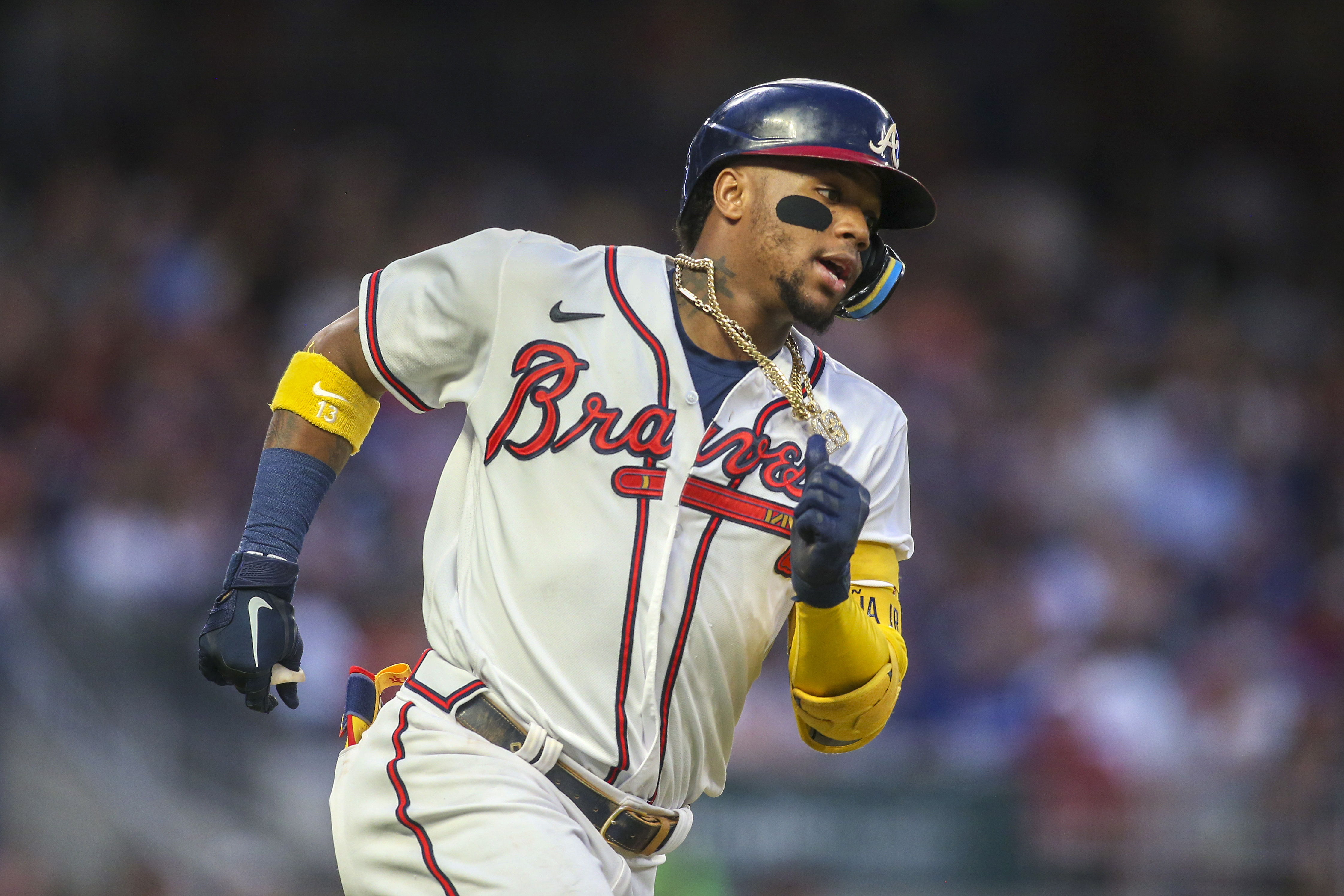Atlanta Braves right fielder Ronald Acuna Jr. (13) hits a single against the Los Angeles Dodgers in the fifth inning at Truist Park.