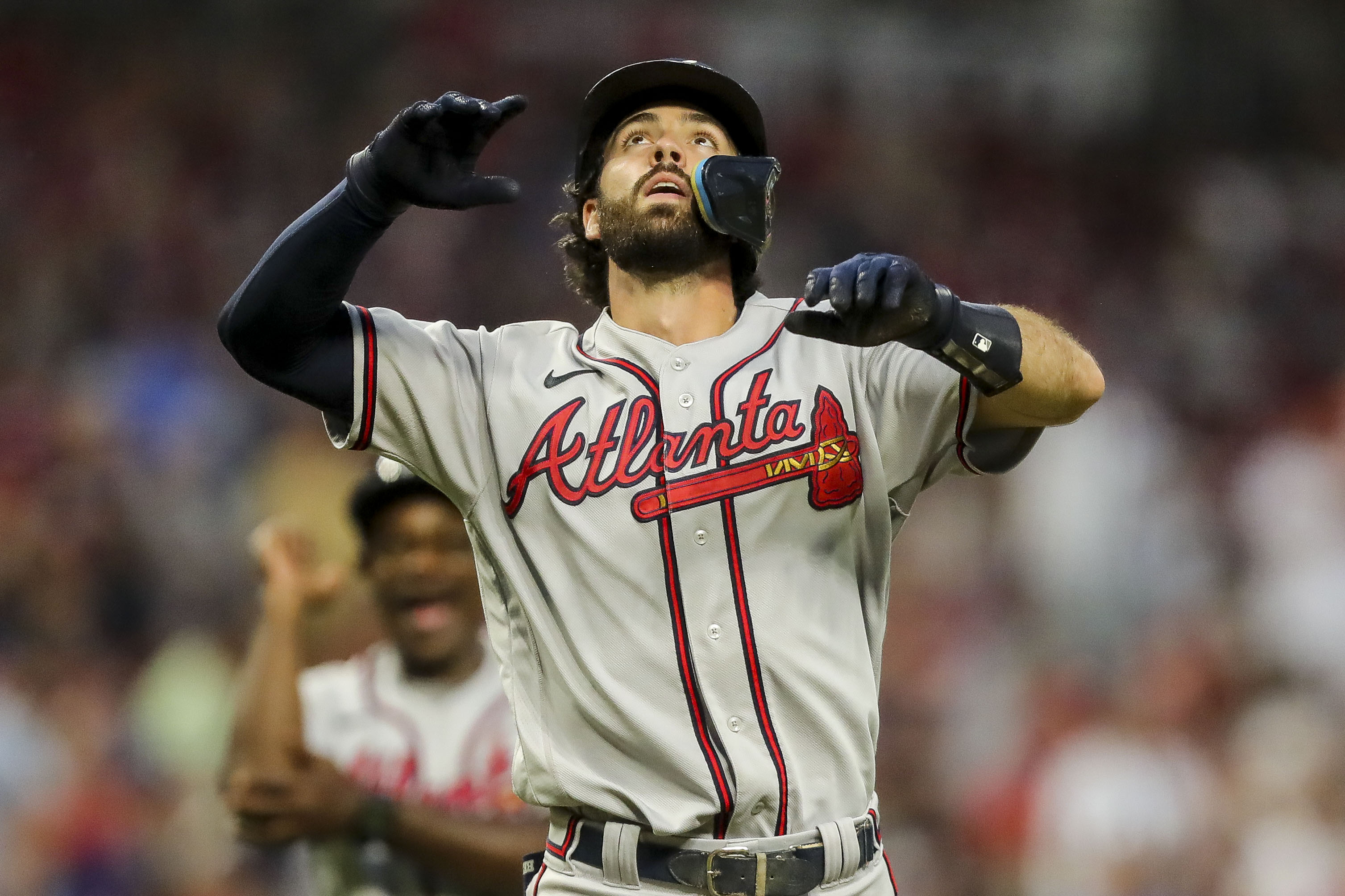 Atlanta Braves shortstop Dansby Swanson (7) reacts after hitting a three-run home run against the Cincinnati Reds in the seventh inning at Great American Ball Park.