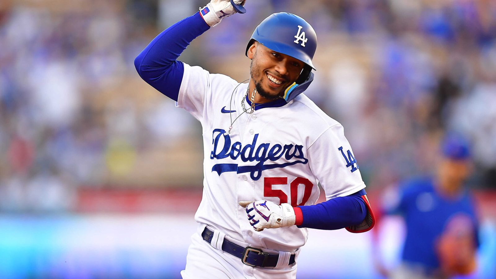 Los Angeles, California, USA; Los Angeles Dodgers right fielder Mookie Betts (50) runs the bases after hitting a solo home run against the Chicago Cubs during the first inning at Dodger Stadium.