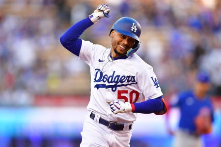 Los Angeles, California, USA; Los Angeles Dodgers right fielder Mookie Betts (50) runs the bases after hitting a solo home run against the Chicago Cubs during the first inning at Dodger Stadium.