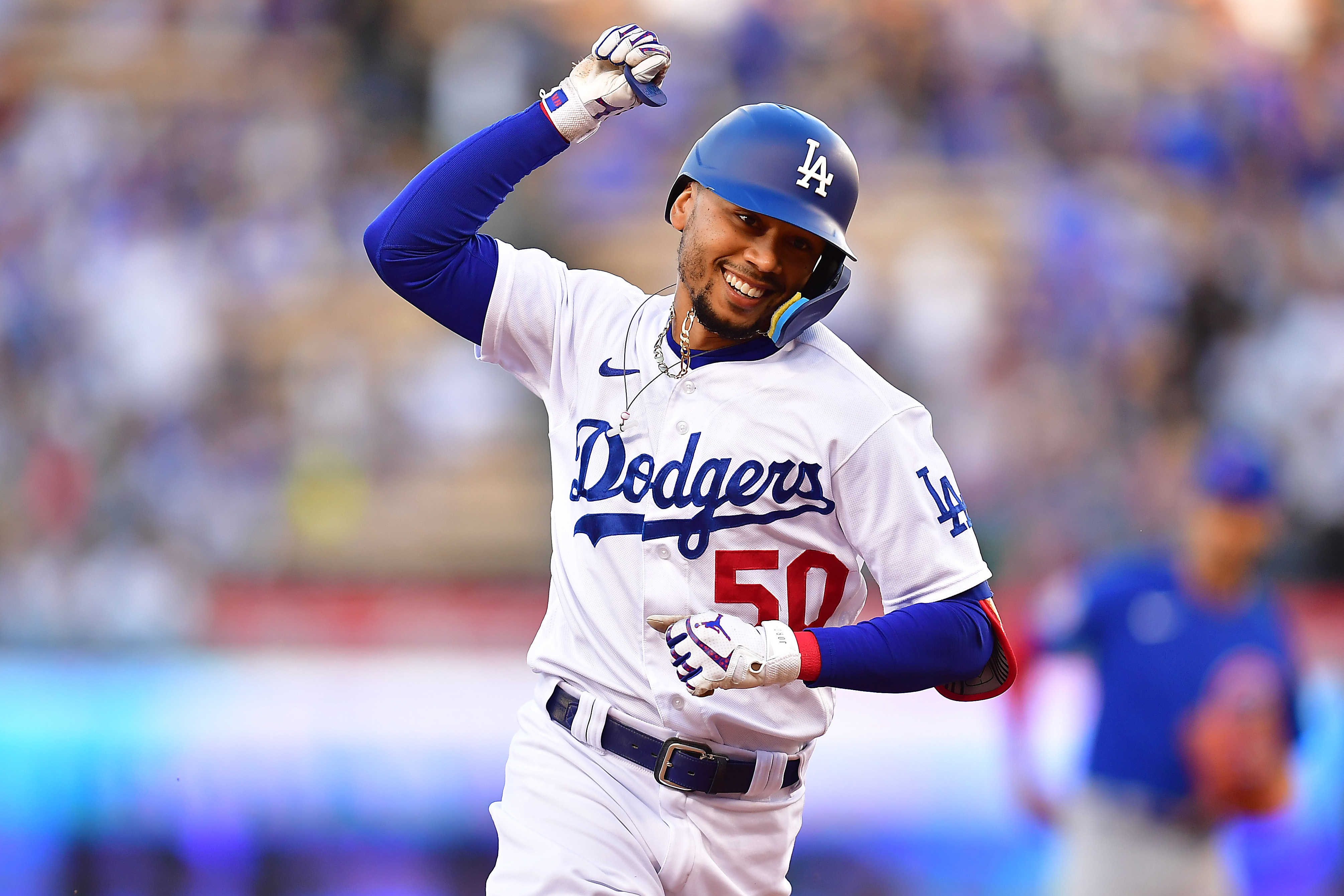 Los Angeles, California, USA; Los Angeles Dodgers right fielder Mookie Betts (50) runs the bases after hitting a solo home run against the Chicago Cubs during the first inning at Dodger Stadium.