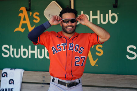 Houston Astros second baseman Jose Altuve (27) stands in the dugout before the start of the game against the Oakland Athletics at RingCentral Coliseum.
