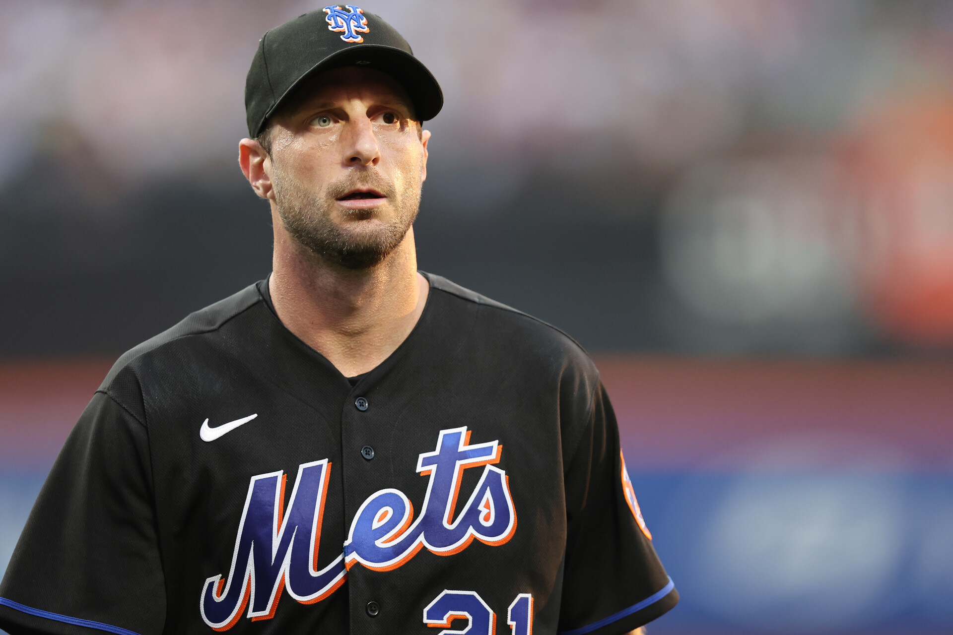New York Mets starting pitcher Max Scherzer (21) walks off the field after the top of the first inning against the San Diego Padres at Citi Field.