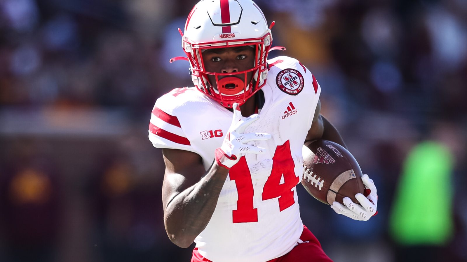 Rahmir Johnson #14 of the Nebraska Cornhuskers runs with the ball against the Minnesota Golden Gophers in the third quarter of the game at Huntington Bank Stadium on October 16, 2021 in Minneapolis, Minnesota.