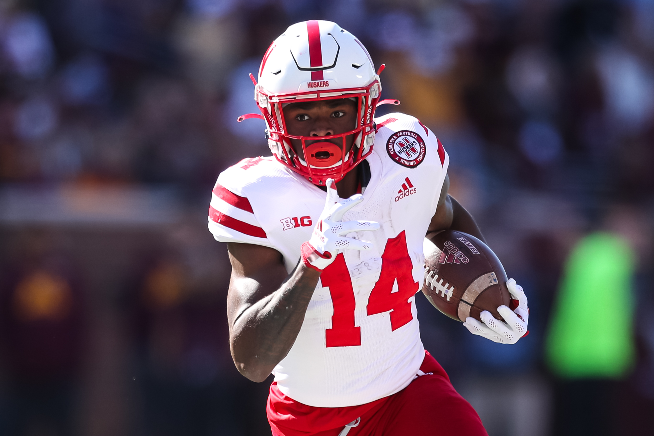 Rahmir Johnson #14 of the Nebraska Cornhuskers runs with the ball against the Minnesota Golden Gophers in the third quarter of the game at Huntington Bank Stadium on October 16, 2021 in Minneapolis, Minnesota.