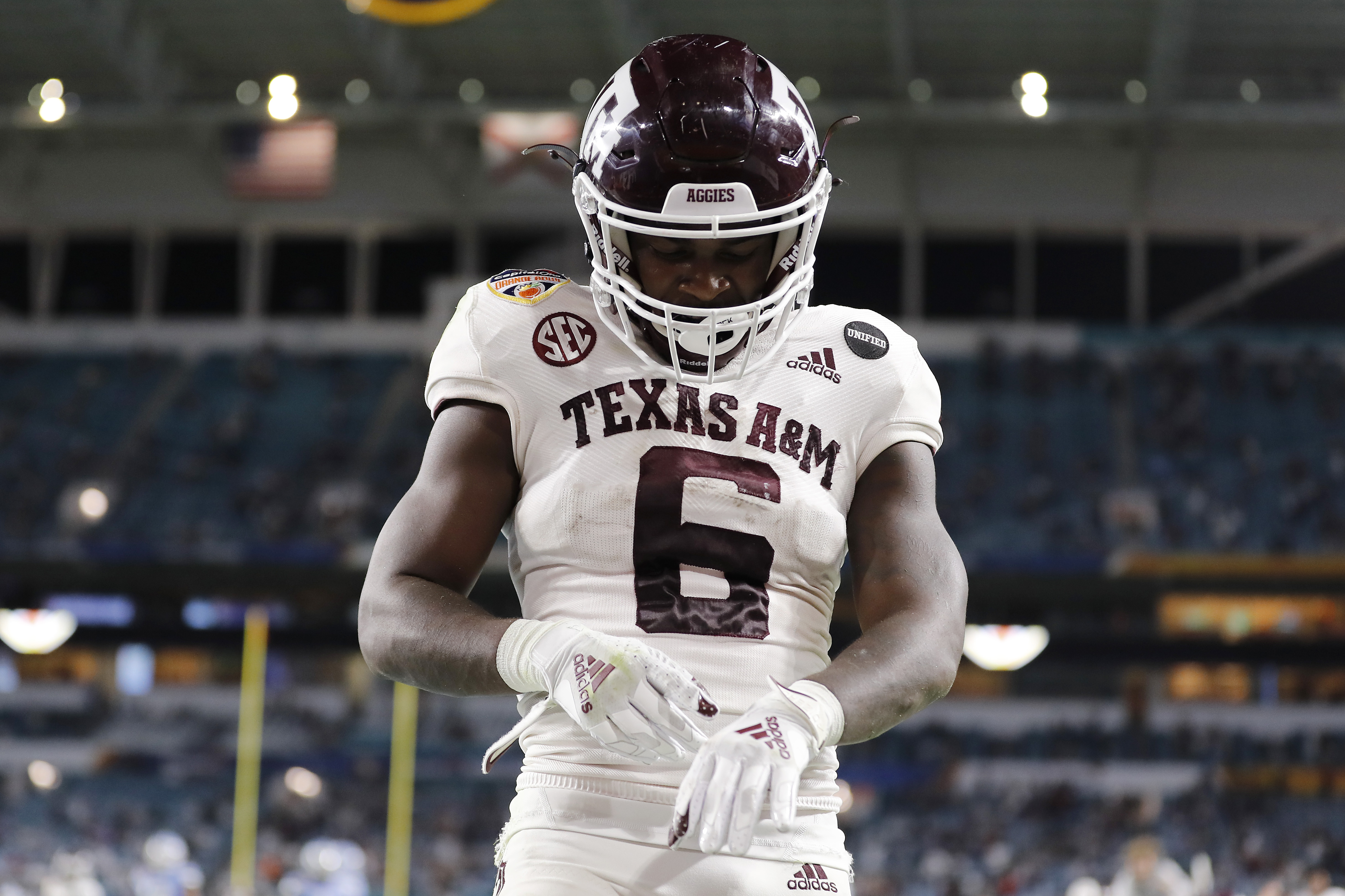 Devon Achane #6 of the Texas A&M Aggies celebrates after scoring a 76-yard touchdown run against the North Carolina Tar Heels during the second half of the Capital One Orange Bowl at Hard Rock Stadium on January 02, 2021 in Miami Gardens, Florida.