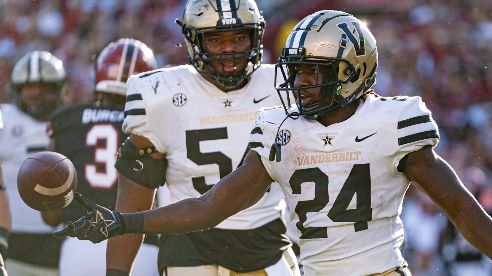 Running back Rocko Griffin #24 of the Vanderbilt Commodores reacts after scoring a touchdown with offensive lineman Tyler Steen #54 during the second quarter during their game against the South Carolina Gamecocks at Williams-Brice Stadium on October 16, 2021 in Columbia, South Carolina.