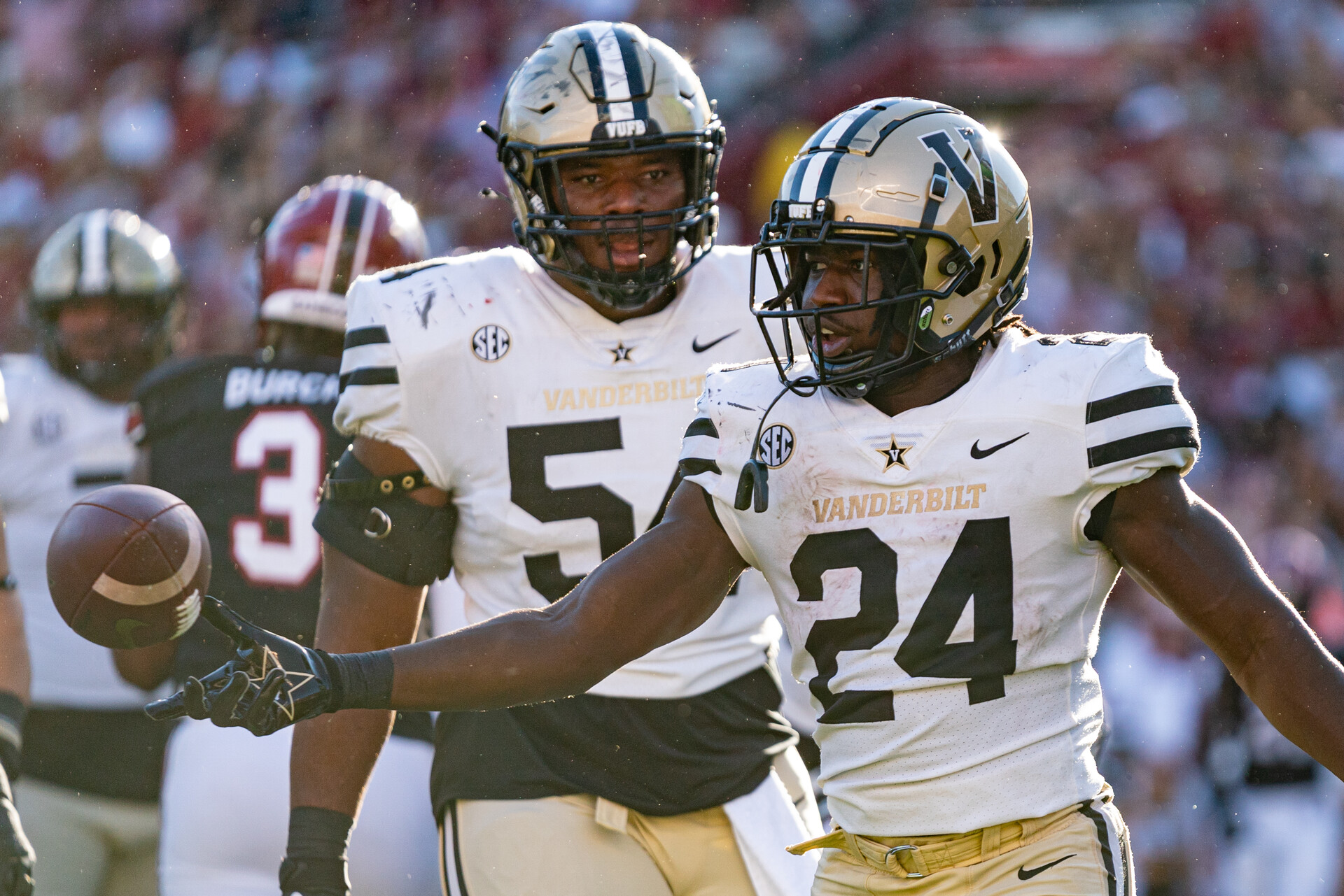 Running back Rocko Griffin #24 of the Vanderbilt Commodores reacts after scoring a touchdown with offensive lineman Tyler Steen #54 during the second quarter during their game against the South Carolina Gamecocks at Williams-Brice Stadium on October 16, 2021 in Columbia, South Carolina.