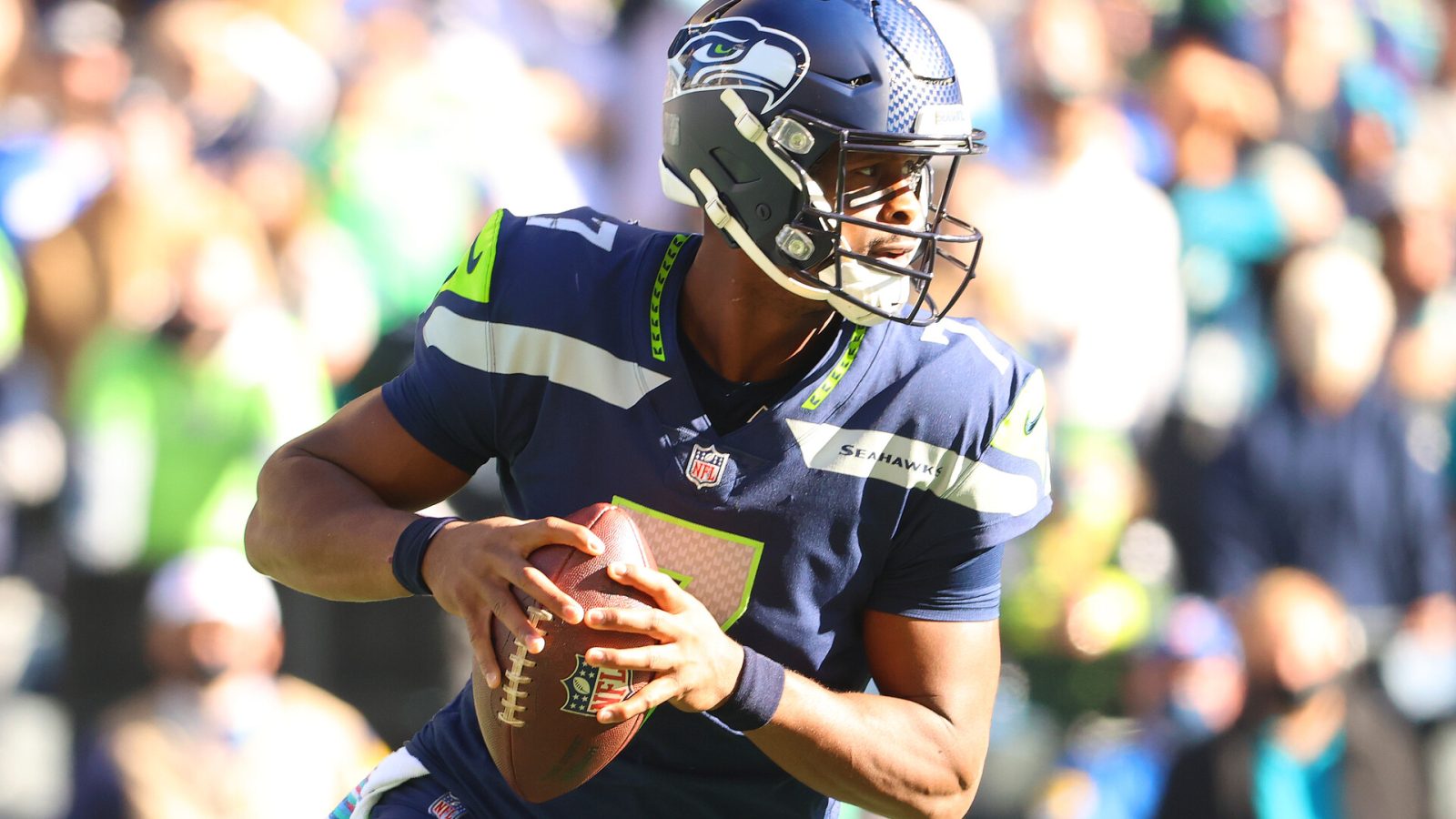 Geno Smith #7 of the Seattle Seahawks looks to throw the ball against the Jacksonville Jaguars during the first quarter at Lumen Field on October 31, 2021 in Seattle, Washington.