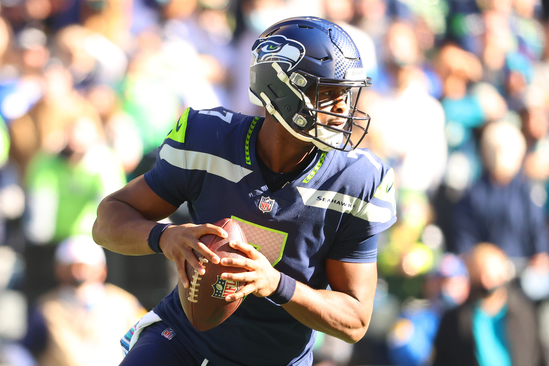 Geno Smith #7 of the Seattle Seahawks looks to throw the ball against the Jacksonville Jaguars during the first quarter at Lumen Field on October 31, 2021 in Seattle, Washington.