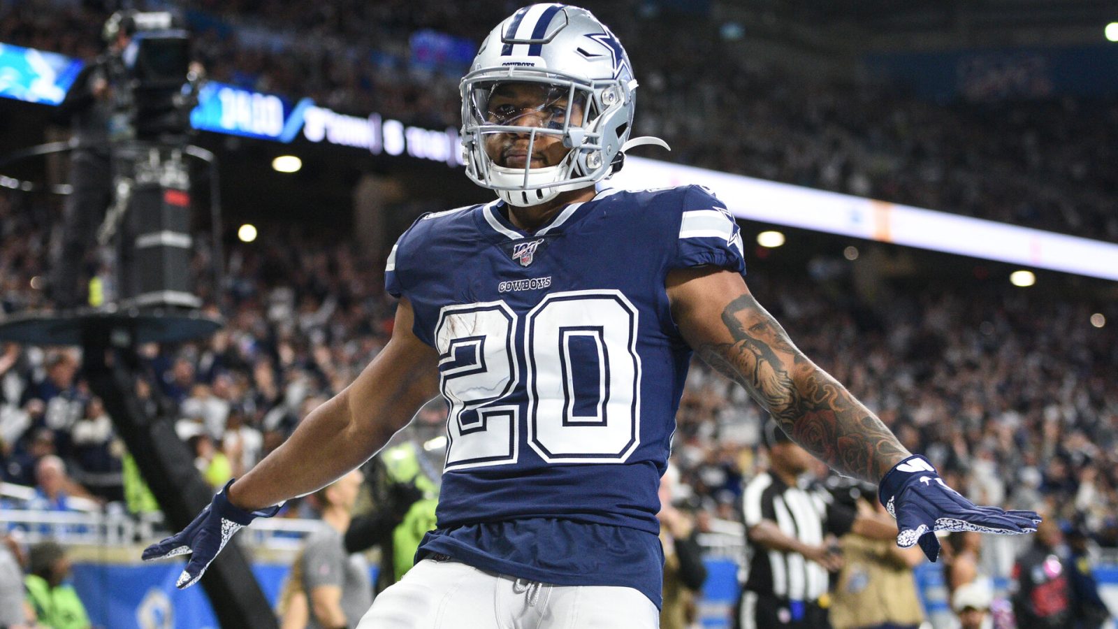 Dallas Cowboys running back Tony Pollard (20) celebrates his touchdown during the first quarter against the Detroit Lions at Ford Field.