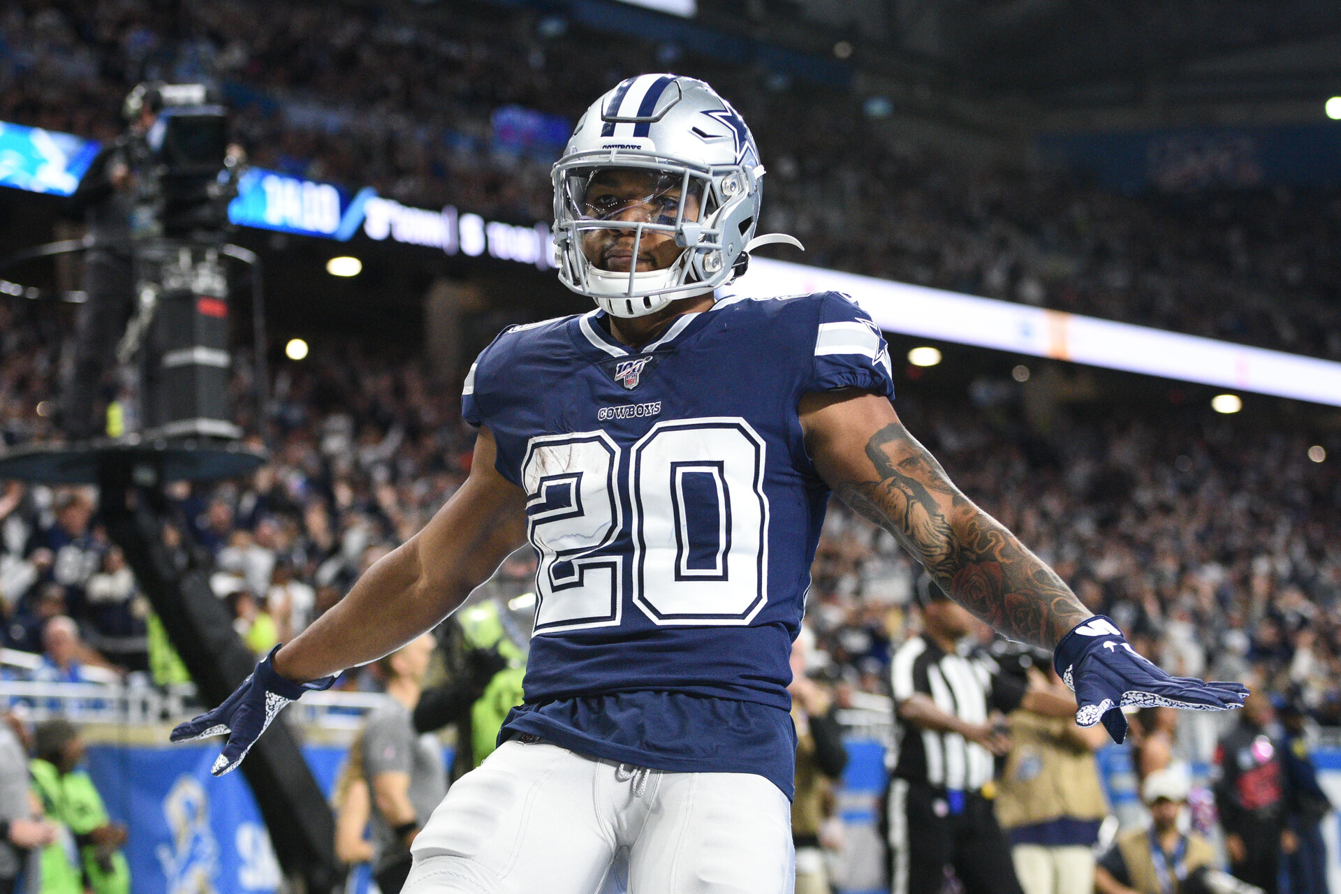 Dallas Cowboys running back Tony Pollard (20) celebrates his touchdown during the first quarter against the Detroit Lions at Ford Field.