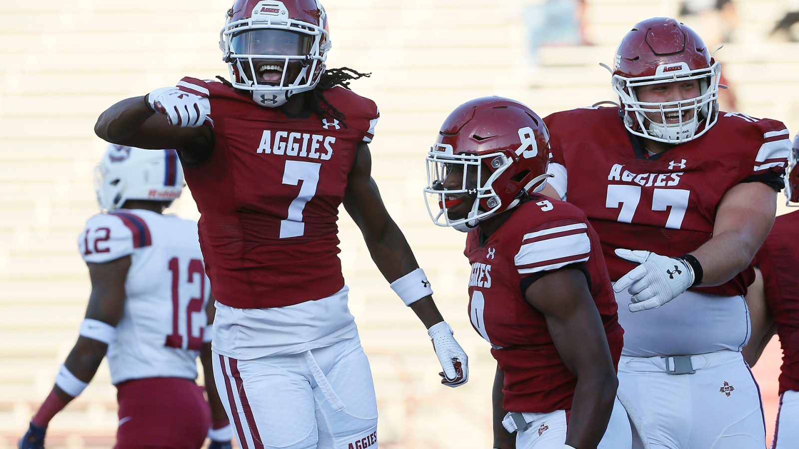 NMSU's D.J. McCullough celebrates Antonio Oliver after scoring a touchdown during the game against South Carolina State Saturday, Sept. 18, 2021, at Aggie Memorial Stadium in Las Cruces.