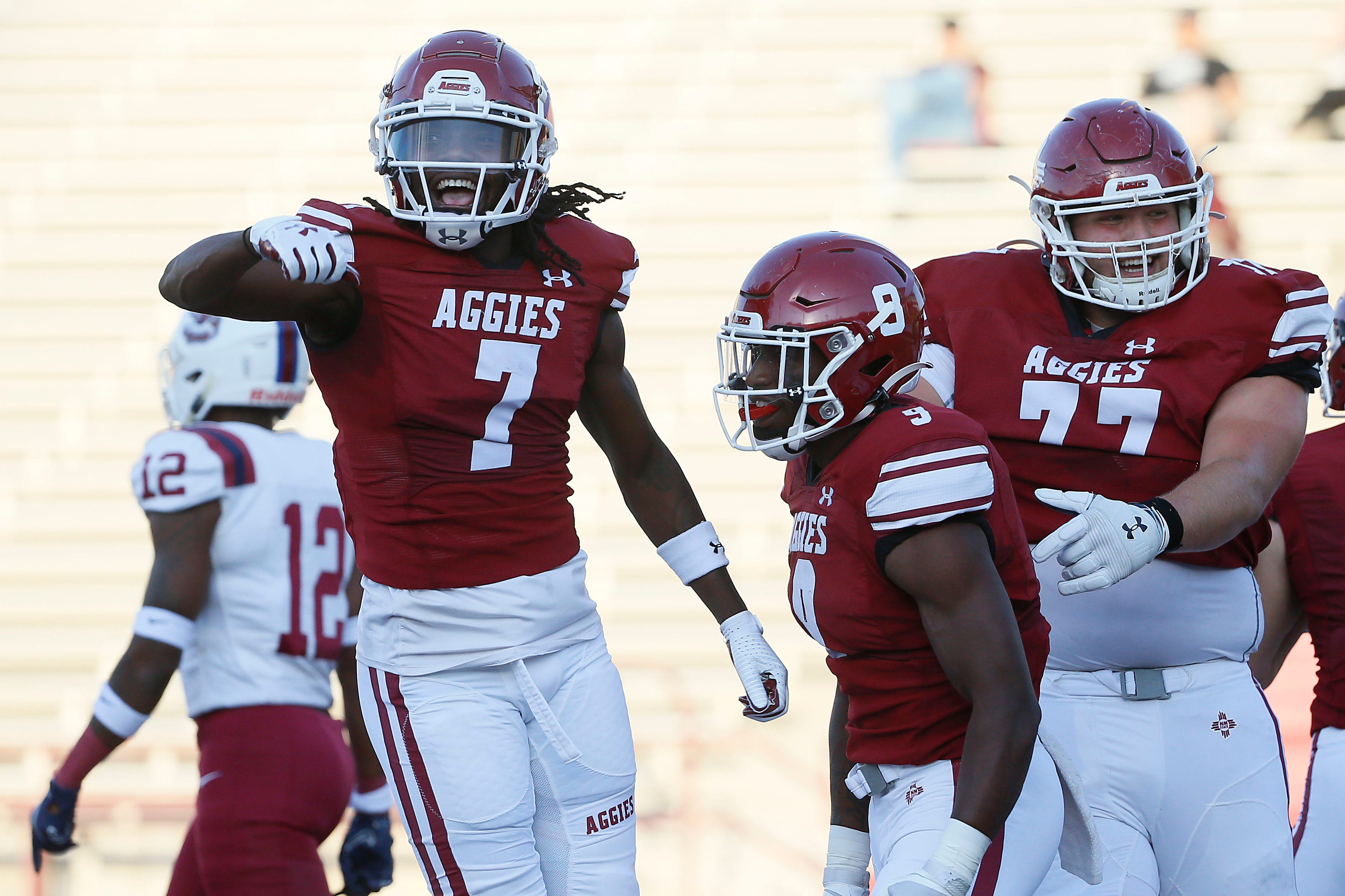 NMSU's D.J. McCullough celebrates Antonio Oliver after scoring a touchdown during the game against South Carolina State Saturday, Sept. 18, 2021, at Aggie Memorial Stadium in Las Cruces.