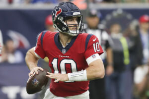 Houston Texans quarterback Davis Mills (10) scrambles against the Indianapolis Colts in the second half at NRG Stadium.