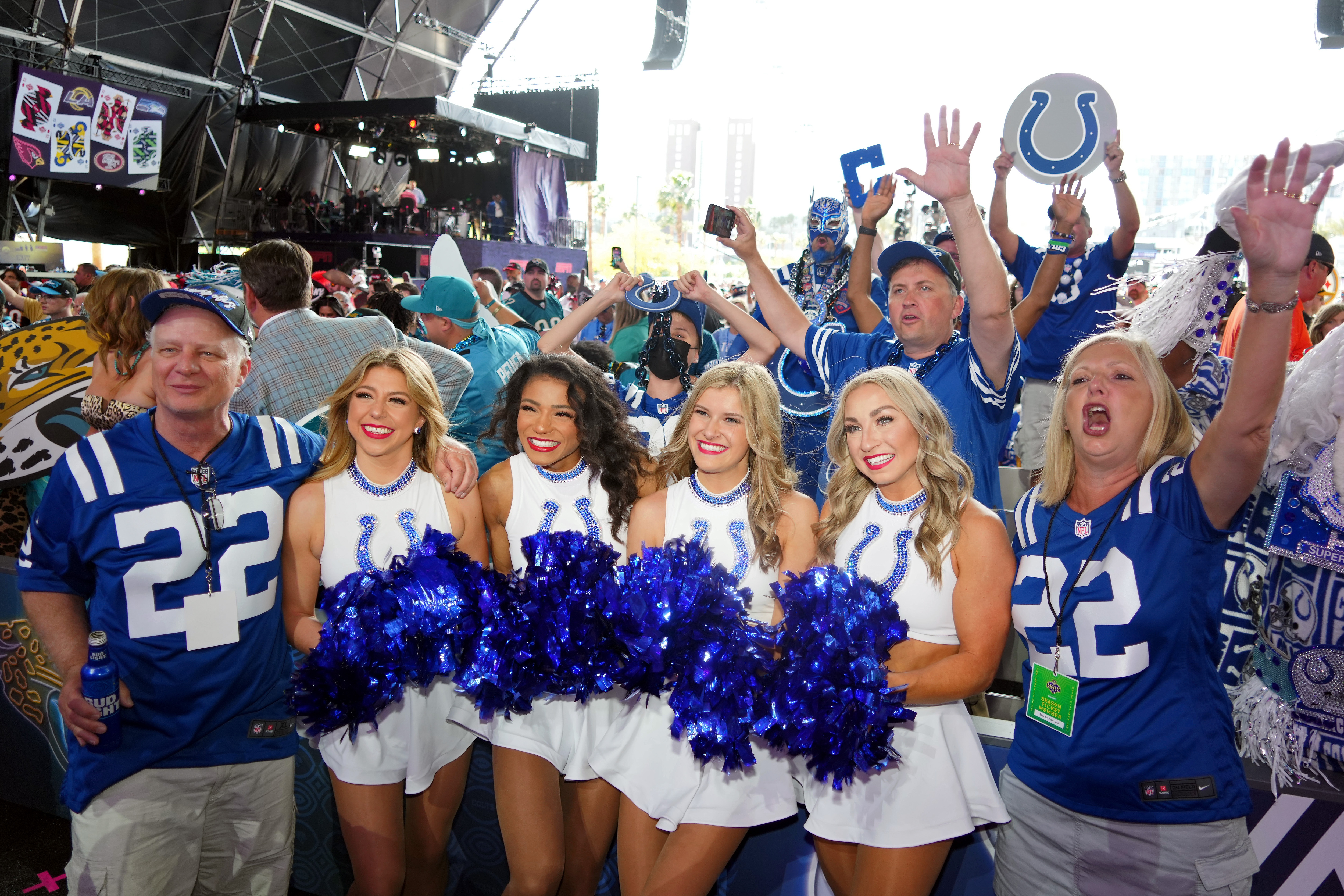 Indianapolis Colts cheerleaders pose for a photo with fans before the first round of the 2022 NFL Draft at the NFL Draft Theater.