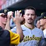 Pittsburgh Pirates center fielder Bryan Reynolds (10) celebrates with teammates after scoring against the St. Louis Cardinals during the first inning at Busch Stadium.