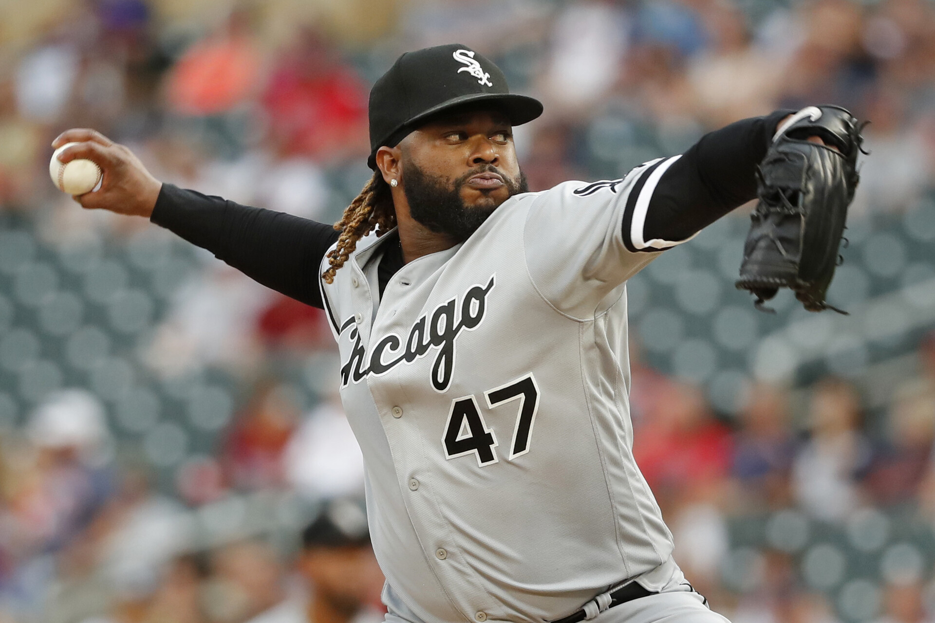 Chicago White Sox starting pitcher Johnny Cueto (47) throws to the Minnesota Twins in the first inning at Target Field.
