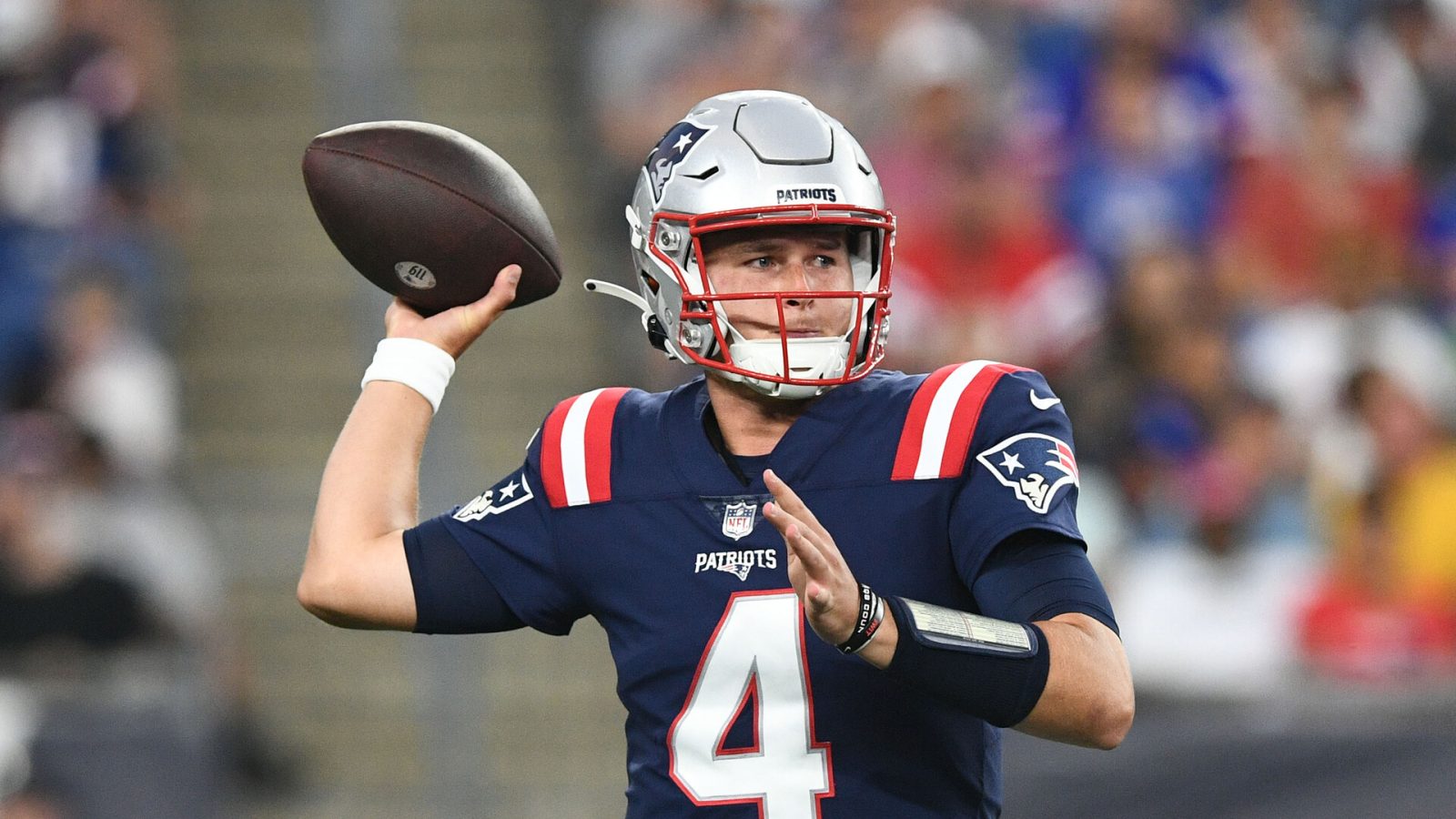 New England Patriots quarterback Bailey Zappe (4) looks to throw the ball against the New York Giants during the first half at Gillette Stadium.