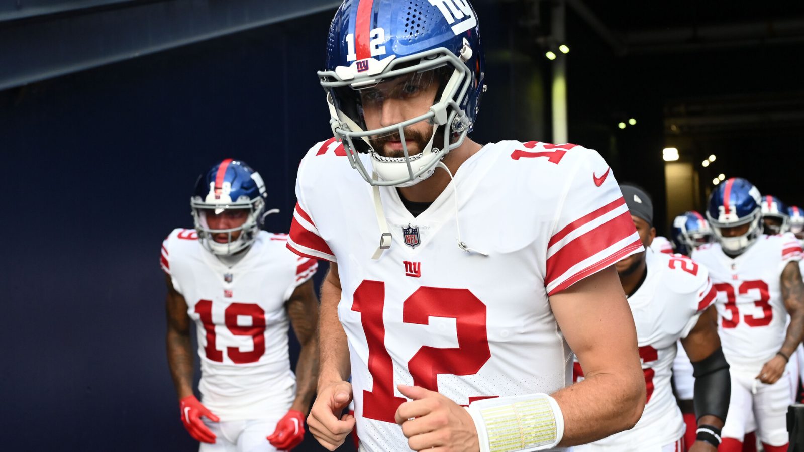 New York Giants quarterback Davis Webb (12) walks onto the field before a preseason game against the New England Patriots during the first half at Gillette Stadium.
