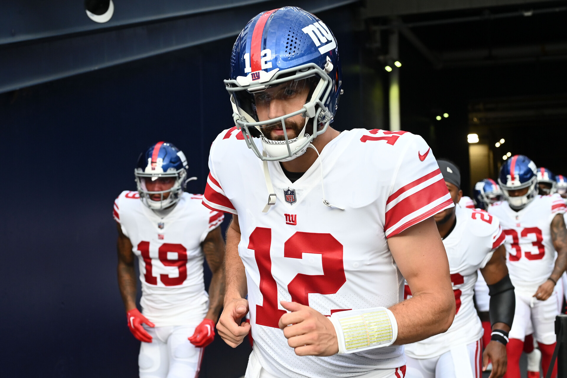 New York Giants quarterback Davis Webb (12) walks onto the field before a preseason game against the New England Patriots during the first half at Gillette Stadium.