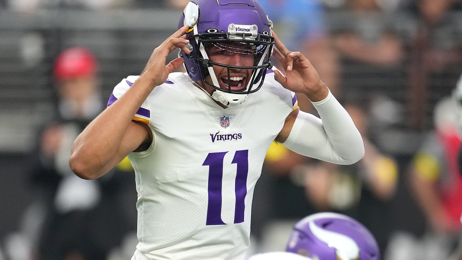 Minnesota Vikings quarterback Kellen Mond (11) calls a play before snapping the ball against the Las Vegas Raiders during a preseason game at Allegiant Stadium.