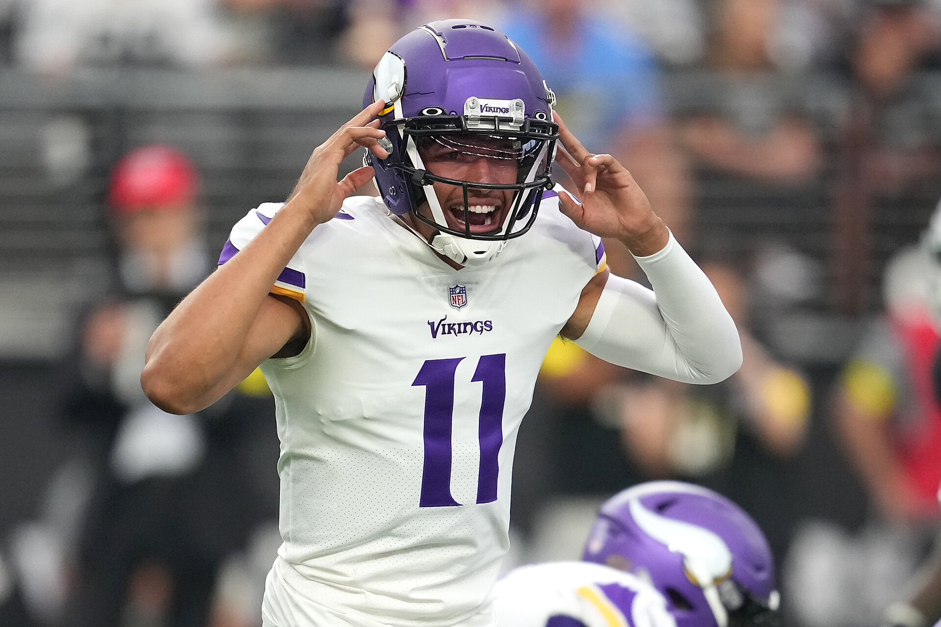 Minnesota Vikings quarterback Kellen Mond (11) calls a play before snapping the ball against the Las Vegas Raiders during a preseason game at Allegiant Stadium.