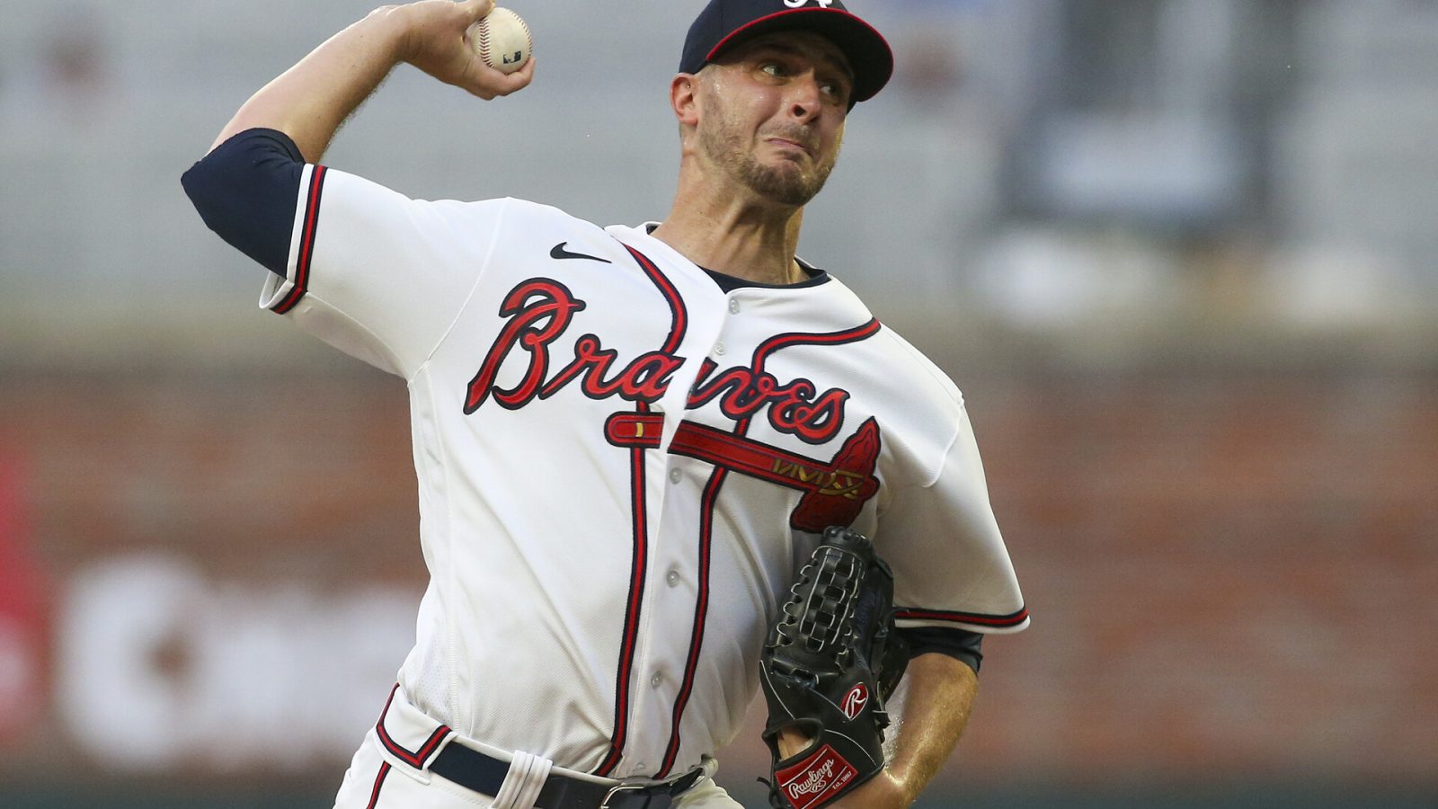 Atlanta Braves starting pitcher Jake Odorizzi (12) throws against the New York Mets in the first inning at Truist Park.