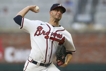 Atlanta Braves starting pitcher Jake Odorizzi (12) throws against the New York Mets in the first inning at Truist Park.
