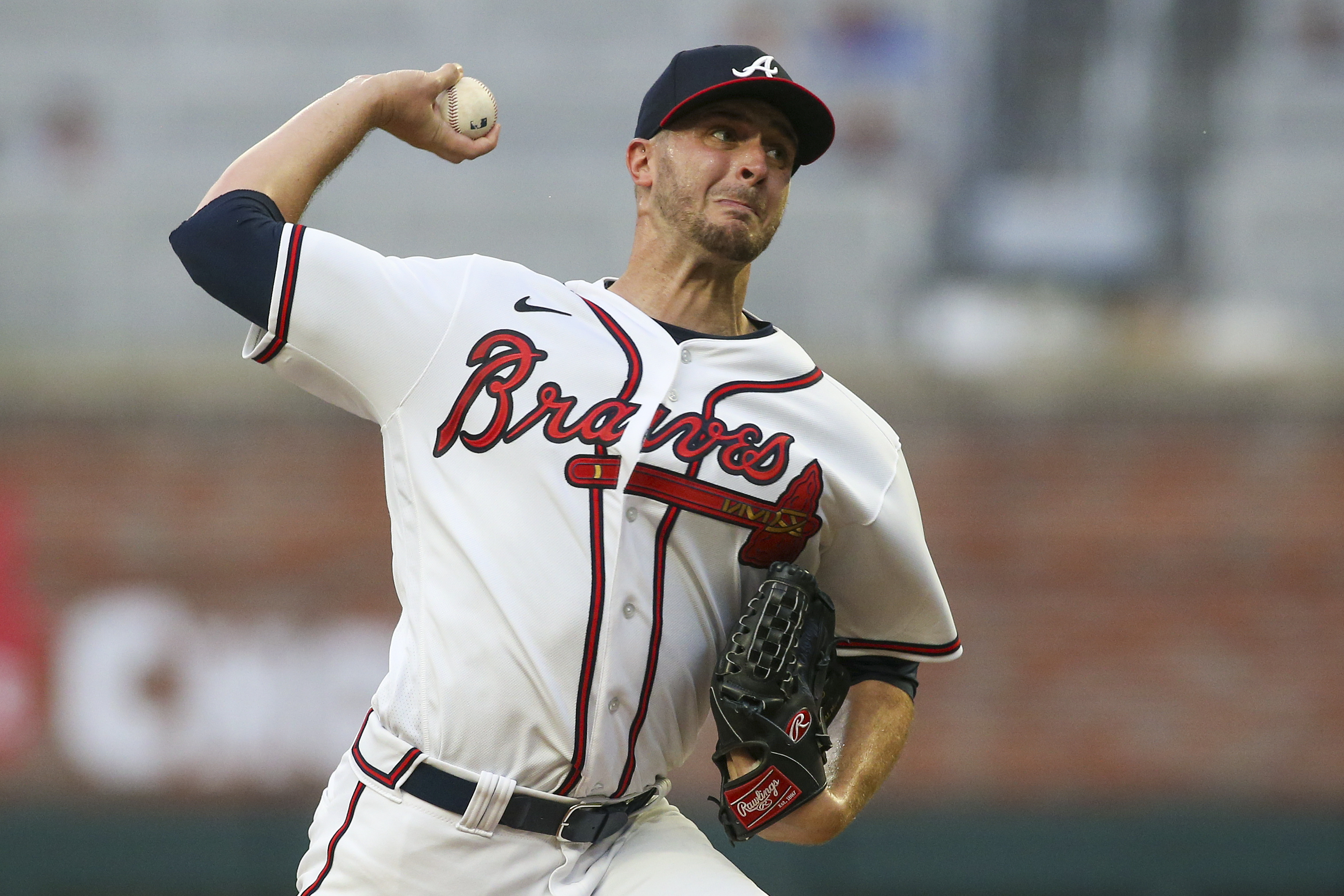 Atlanta Braves starting pitcher Jake Odorizzi (12) throws against the New York Mets in the first inning at Truist Park.