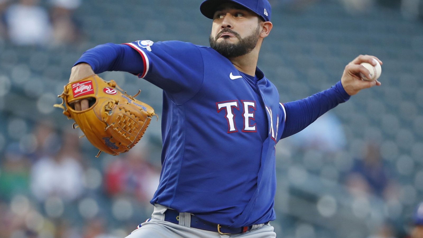 Aug 19, 2022; Minneapolis, Minnesota, USA; Texas Rangers starting pitcher Martin Perez (54) throws to the Minnesota Twins in the first inning at Target Field.