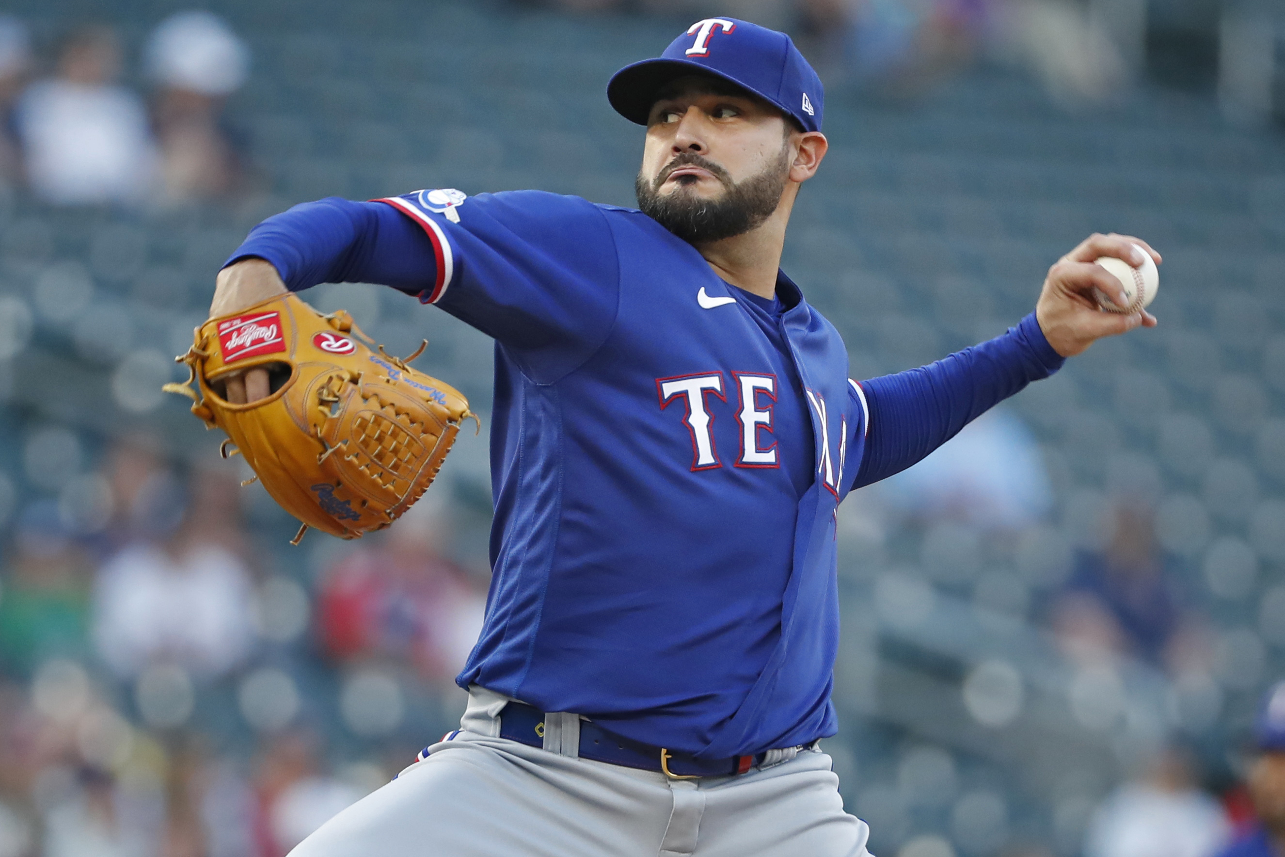 Aug 19, 2022; Minneapolis, Minnesota, USA; Texas Rangers starting pitcher Martin Perez (54) throws to the Minnesota Twins in the first inning at Target Field.