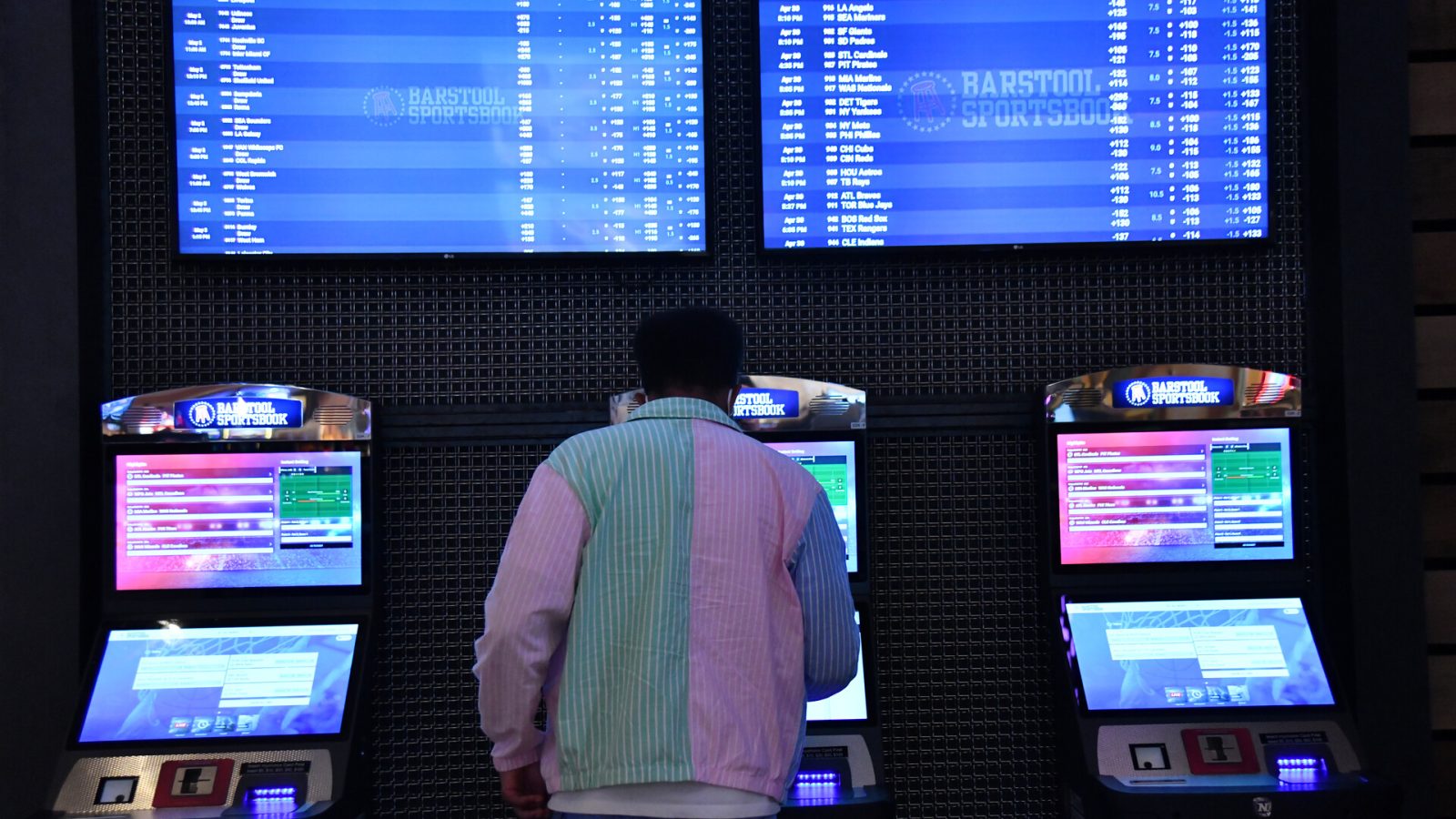 A customer purchase a ticket from a betting kiosk at Barstool Sportsbook in Ameristar Black Hawk in Black Hawk, Colorado on Friday, April 30, 2021.