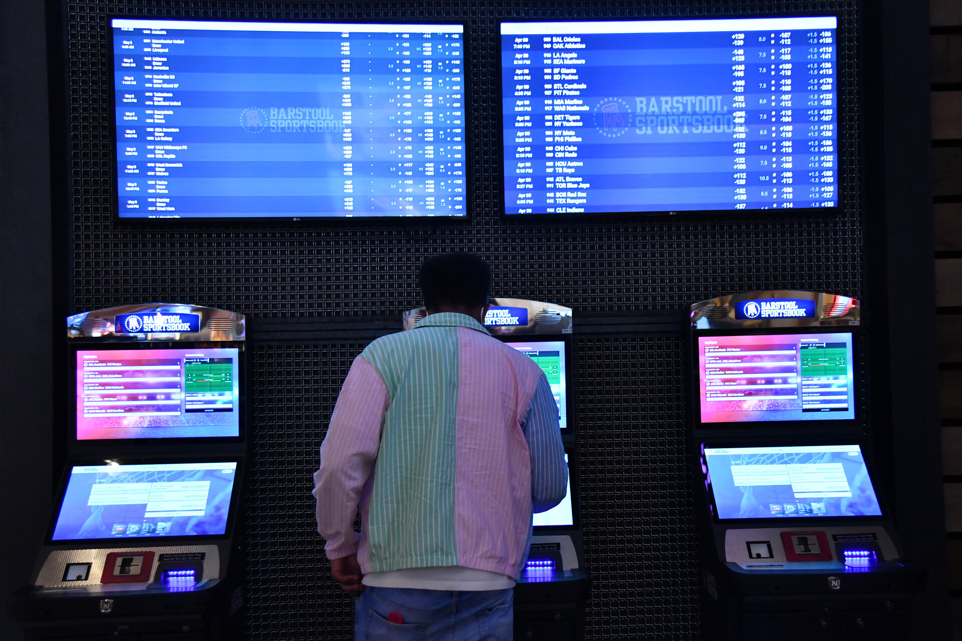 A customer purchase a ticket from a betting kiosk at Barstool Sportsbook in Ameristar Black Hawk in Black Hawk, Colorado on Friday, April 30, 2021.
